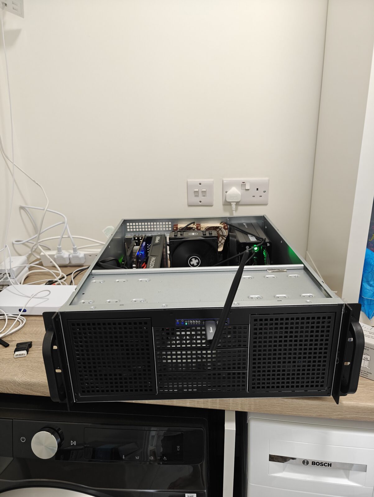 The Dublin server: a 4U rack chassis open on a shelf, the R9700 build visible inside